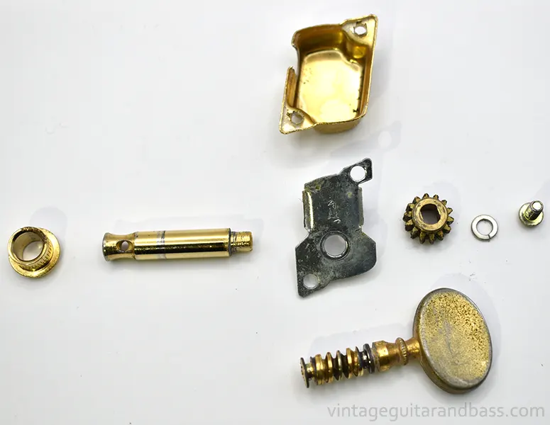 Disassembled Matsumoku closed gear individual tuner showing constituent parts (underside view)