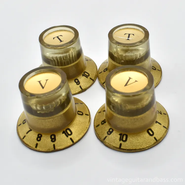 A full set of four Matsumoku metal capped control knobs in gold