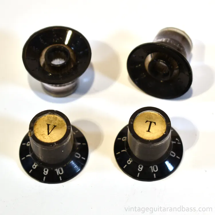 A full set of four Matsumoku metal capped control knobs in black