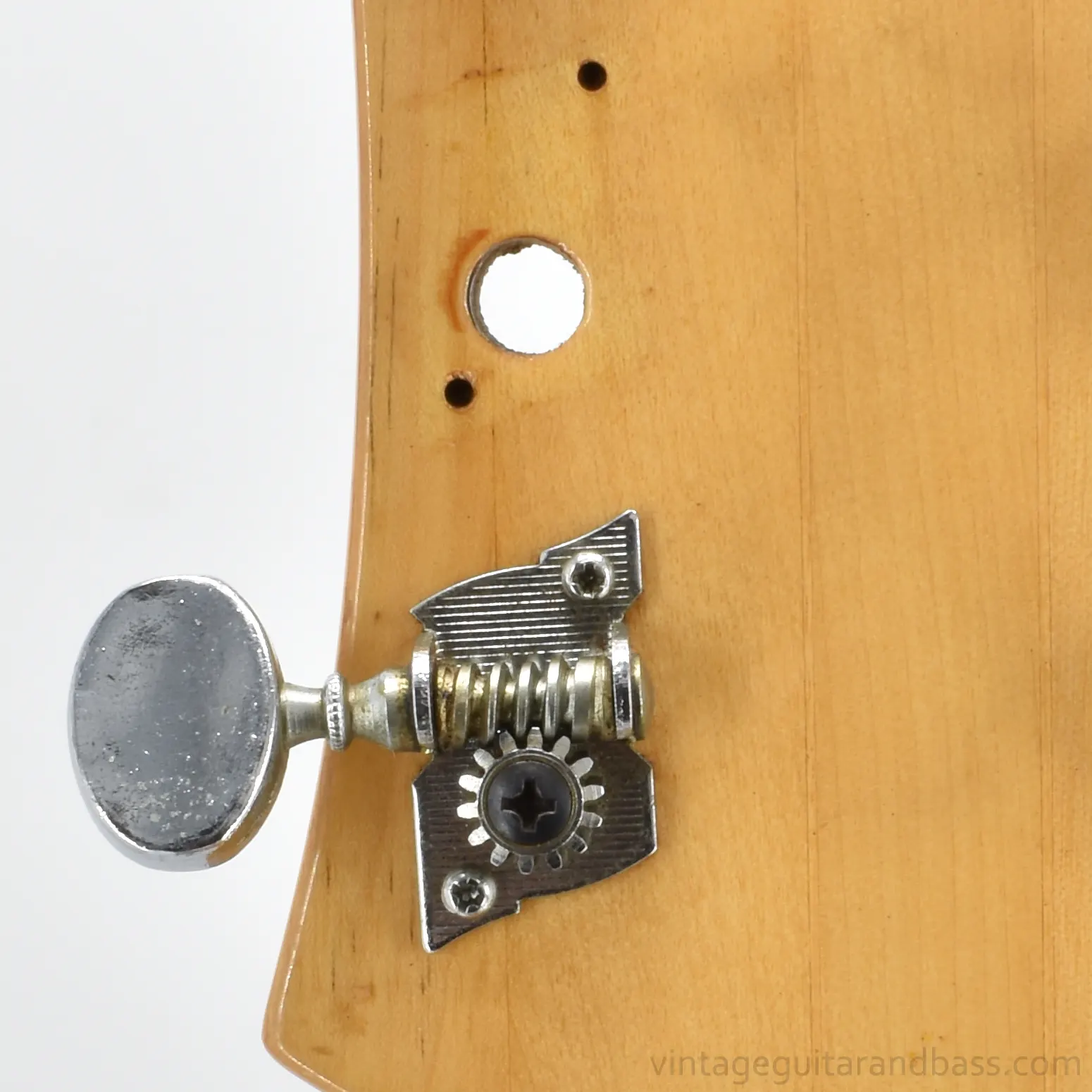 Epiphone 1802T headstock with one tuning key removed, reverse view